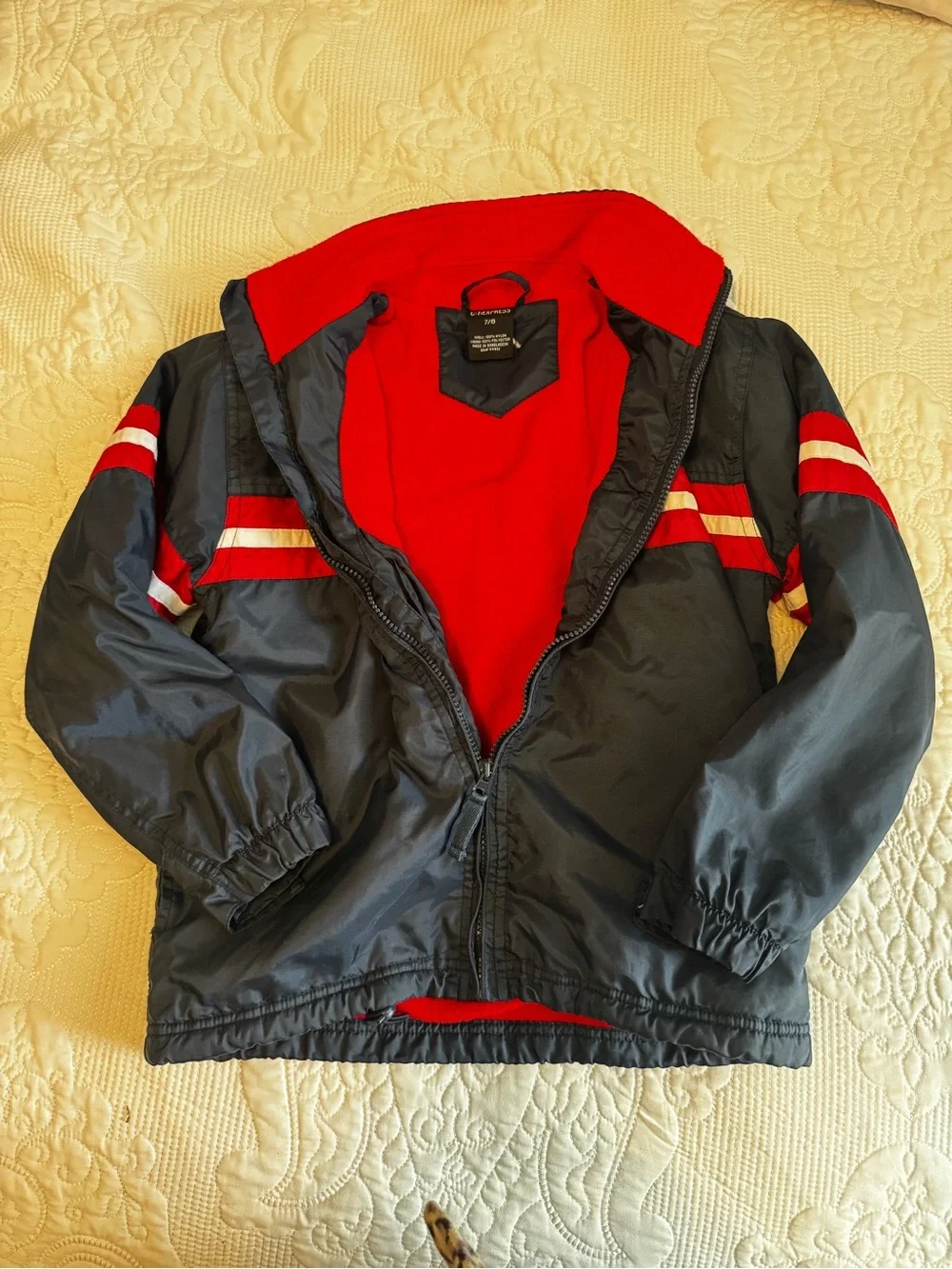 Express Navy Raincoat with Red and White Stripe Detail